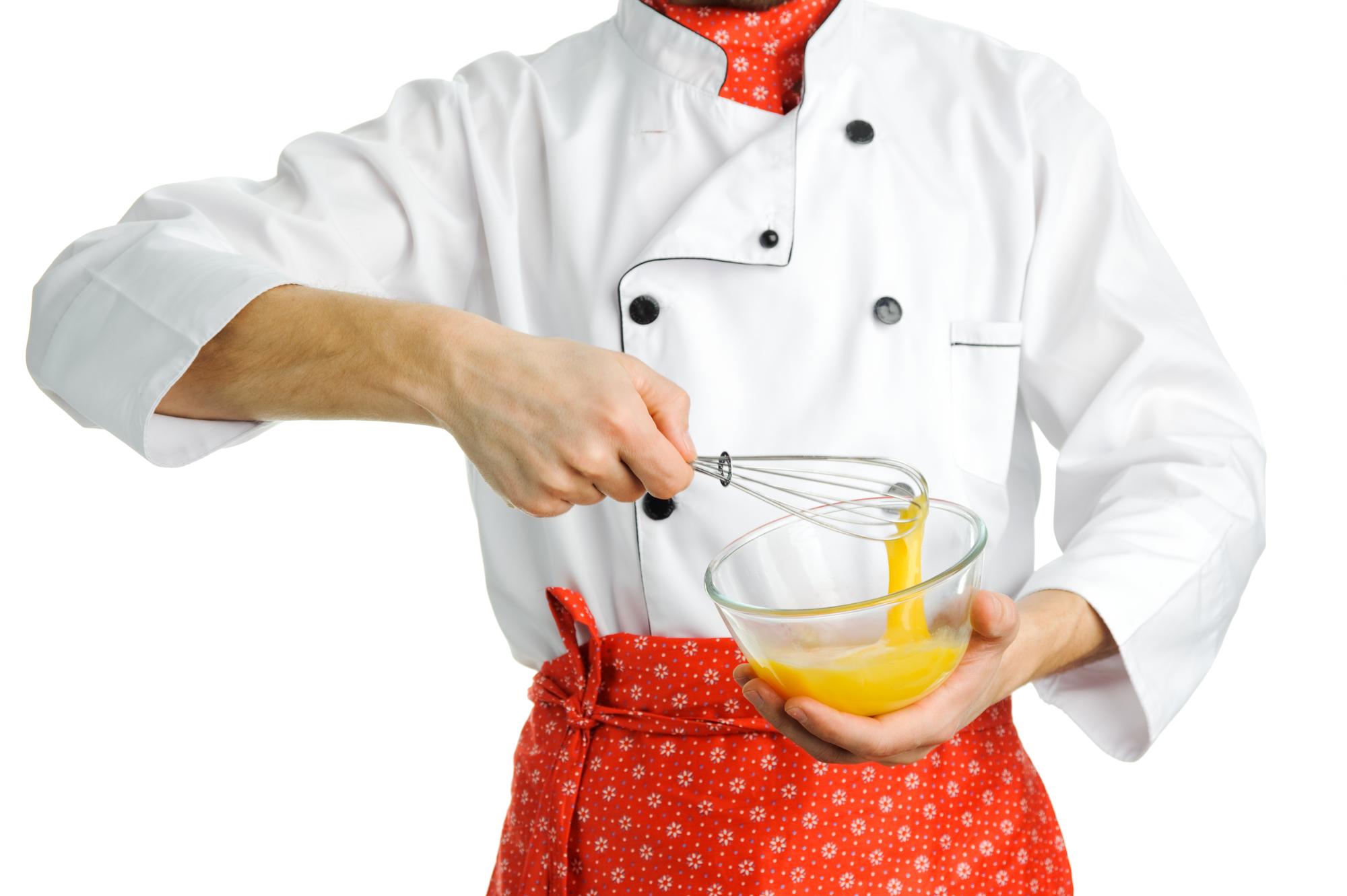 Instructor demonstrating sauce technique to class